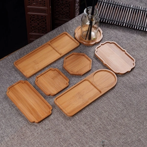 Detailed arrangement of 7 bamboo coasters and trays on grey linen for DIY mosaic art