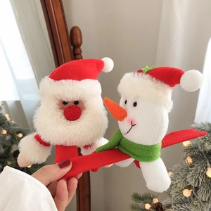 Plush Christmas slap bracelets featuring Santa and Snowman figures for holiday party decor