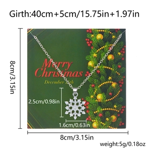 Silver snowflake necklace with diamonds on a Merry Christmas card showing dimensions