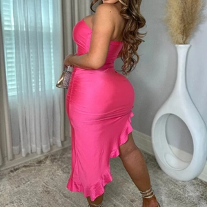 Detail of fuchsia off-shoulder bodycon dress with ruffle hem and satin finish