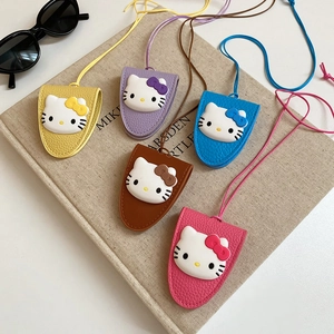 Close-up of colorful cat themed leather keychain pendants with woven cords and sunglasses