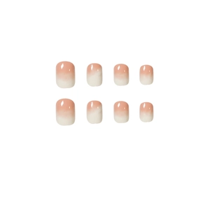 Glossy nude pink gradient press-on nails with short round shape on white background
