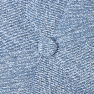 Macro detail of a blue denim newsboy cap featuring a stitched top button and twill texture