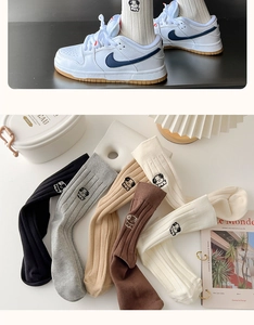 Detail of five-color cotton crew socks featuring cute puppy embroidery and ribbed cuffs