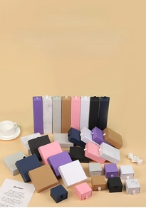 Detailed view of various colorful drawer-style jewelry gift boxes with marble patterns