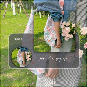 Detailed close-up of floral print tote bag featuring snap button and large capacity design
