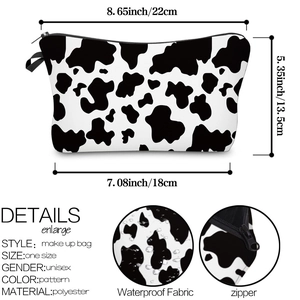 Detail view of cow print makeup bag showing dimensions and waterproof polyester fabric texture