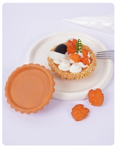 Macro detail of artificial PVC tart shell and dessert model with DIY handmade components