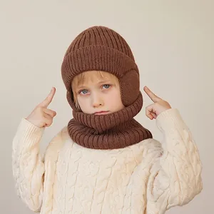Winter knitted hat and neck warmer set for boys with warm ear flaps in dark brown color