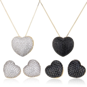 Golden heart jewelry set with pavé cubic zirconia necklaces and matching stud earrings