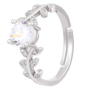 Macro detail of leaf-shaped ring with round brilliant cut zircon and pave leaf accents