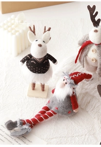 Detail of wool felt Santa Claus and reindeer dolls with wooden base for Christmas decor