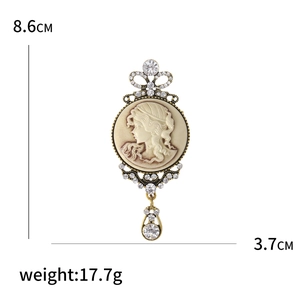 Vintage gold portrait brooch with rhinestones and crown pendant, size 8.6cm by 3.7cm
