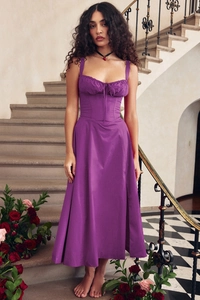Detail of purple strap dress featuring a front lace-up pleated bust and slim waist design