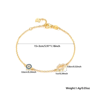 Detailed view of gold S925 silver bracelet featuring evil eye and hamsa hand charms