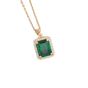 Elegant emerald cut green gemstone pendant necklace with gold chain and zircon stones