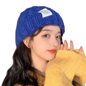 Thick knitted cable beanies for men and women in klein blue color for winter warmth