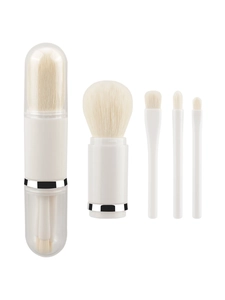 Detail of 4-in-1 portable makeup brush set with white bristles and silver accents
