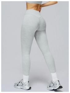 Close-up of high-waisted gray yoga pants featuring heathered texture and butt-lifting seams