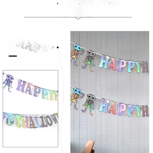 Detail of laser iridescent Happy Halloween banner with moveable skeleton decoration