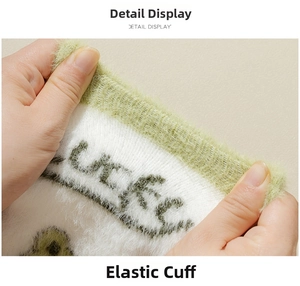 Detail showing the high elasticity ribbed cuff of the green plush frog socks for winter