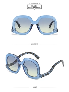 Front and side view of large blue transparent sunglasses with yellow gradient lenses