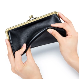 Elegant black leather evening clutch with vintage metal clasp frame shown in flexible texture