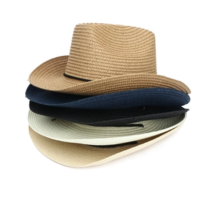 Detailed macro view showing diverse color options and fine woven texture of straw fedora hats