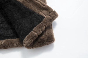 Close-up of premium dark brown faux fur coat with thick black lining and soft texture