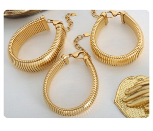 Three chunky 18K gold plated titanium chain bracelets with lobster clasps and extenders