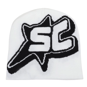 Close-up of the intricate knit pattern and black SC jacquard logo on white beanie