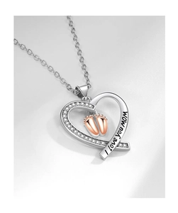 Detail of silver heart necklace with rose gold baby feet and I love you mom engraving