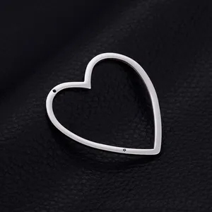 Polished gold-plated heart-shaped pendant frame for DIY jewelry making on black leather