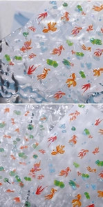 Macro detail of 3D embossed koi fish and lotus nail stickers with laser effect