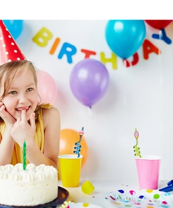 Colorful birthday party set featuring cartoon ice cream straws and vibrant decorations