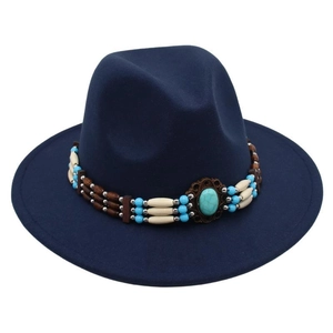 Detail of ethnic beaded band with turquoise stone on dark blue felt jazz hat