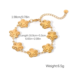 Detailed view of a gold star charm bracelet with dimensions 16.9cm plus 5.3cm extension