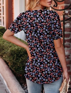 Back view of a casual floral short sleeve t-shirt with blue and pink patterns