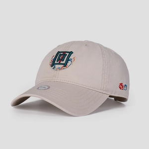 Detail of Chinese style embroidery on a beige baseball cap with cloud patterns