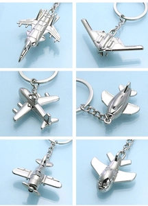 Collage of six silver aircraft model keychains including fighter jets and bombers