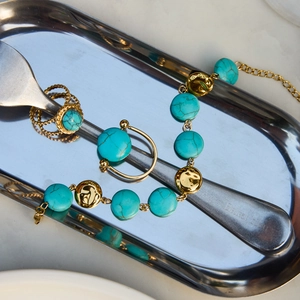 Luxury gold-plated stainless steel jewelry set with round turquoise stone details