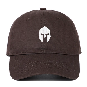 Close-up of white spartan helmet embroidery on a dark brown cotton baseball cap