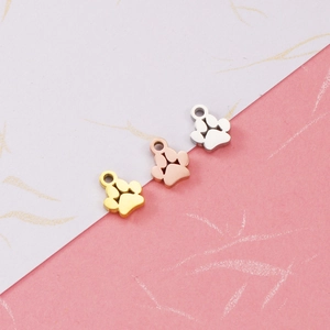 Mirror polished stainless steel dog paw pendants in gold, rose gold and silver finishes