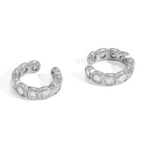 Pair of silver stainless steel ear cuffs featuring clear cubic zirconia in bezel setting
