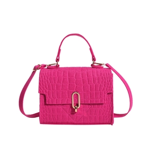 Magenta faux leather crossbody bag with crocodile texture and gold U-shaped metal lock