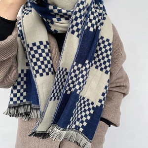 Thick warm checkered scarf with blue and beige checkerboard pattern and fringe tassels