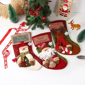 Close-up of festive Christmas stockings with 3D Santa, Snowman and Reindeer characters