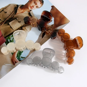 Set of four glossy round link shark hair claws in amber, cream, grey and brown colors