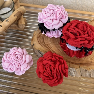 Handmade fabric rose flower hair claw clips in pink and red for an elegant hairstyle