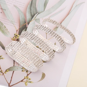 Detail of silver-plated elastic bracelets in various widths with sparkling rhinestones